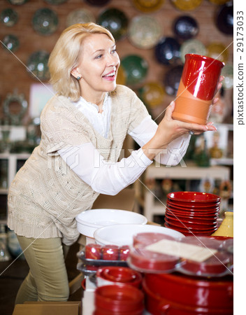 Woman posing with ceramic tableware 29173033