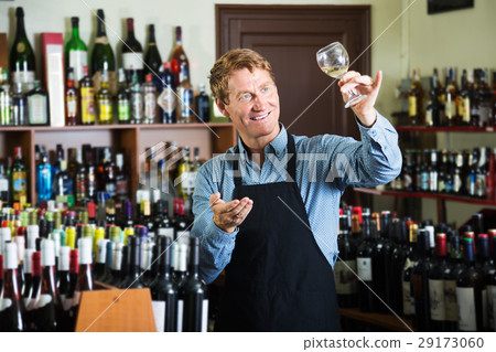 Seller man in wine store 29173060