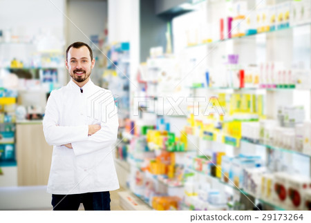 Male pharmacist displaying assortment of drugs Male pharmacist displaying assortment of drugs 29173264