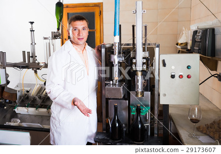 line operator working in wine factory. line operator working in wine factory. 29173607