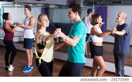 Dancing couples learning salsa 29173899