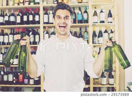 man buying bottle of wine man buying bottle of wine 29173989