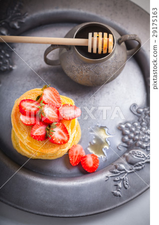 Stack of sweet pancakes with strawberry and honey. Stack of sweet pancakes with strawberry and honey. 29175163