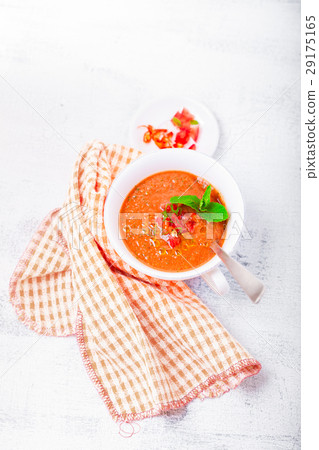 Bowl of Fresh tomato soup Gazpacho on a white 29175165