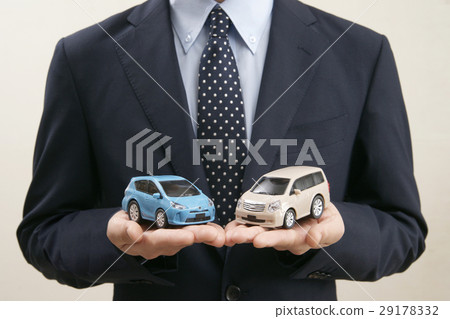 Model of car held by men in both hands Model of car held by men in both hands 29178332