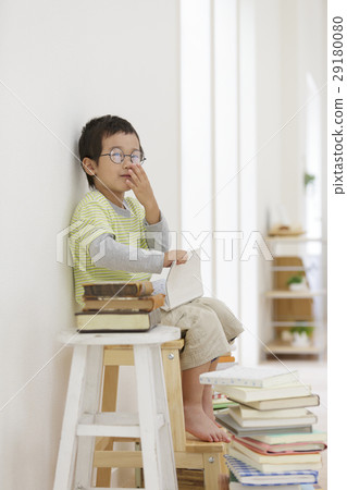 Boy holding a book 29180080