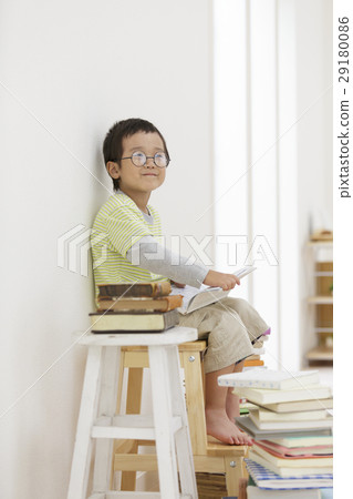 Boy holding a book 29180086