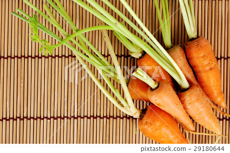 carrots close up on wood background 29180644