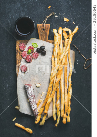 Grissini bread sticks, sausage, olives and red Grissini bread sticks, sausage, olives and red 29180645