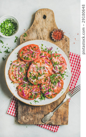 Fresh tomato, parsley and onion salad on shabby Fresh tomato, parsley and onion salad on shabby 29180648