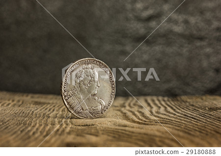 Closeup of old russian coin on a wooden background Closeup of old russian coin on a wooden background 29180888