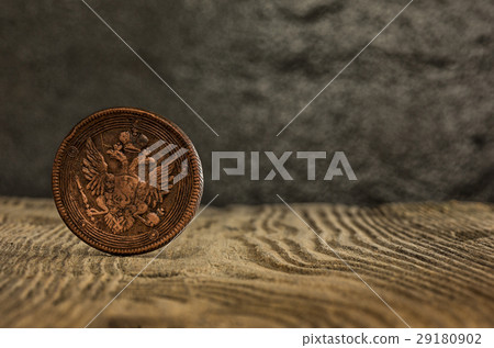 Closeup of old russian coin on a wooden background 29180902