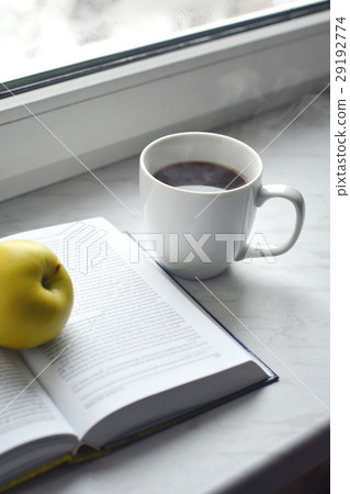 Cozy home still life: cup of hot coffee and opened 29192774