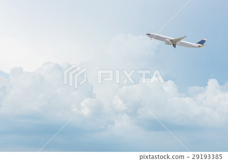 Commercial airplane flying over bright blue sky 29193385