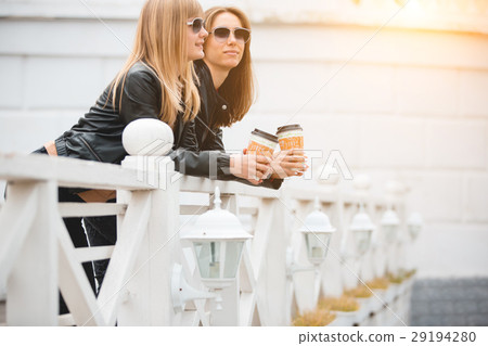 Portrait of two beautiful young girlfriends with Portrait of two beautiful young girlfriends with 29194280