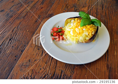 Baked Grilled Potato with stuffing cheese and corn 29195136