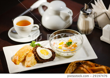 fied egg on meat with salad on plate fied egg on meat with salad on plate 29197476