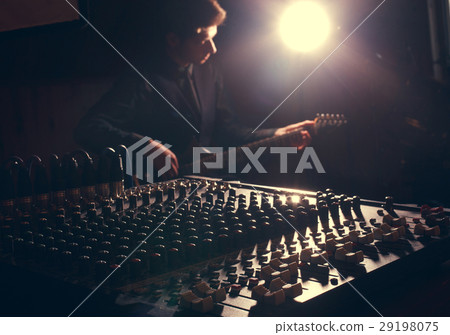 guitarist recording and playing guitar 29198075