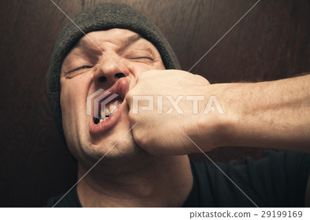 Strong fist punching the face, fight 29199169