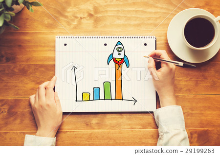 Rocket Graph with a person holding a pen Rocket Graph with a person holding a pen 29199263