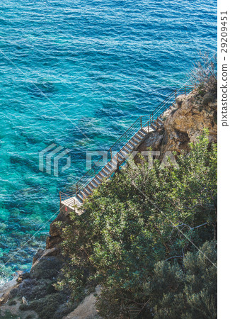 Stairs leading down to lagoon and turquoise sea Stairs leading down to lagoon and turquoise sea 29209451
