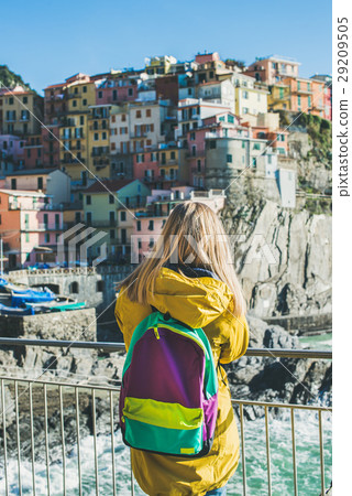 Young blond tourist woman looking at Riomaggiore Young blond tourist woman looking at Riomaggiore 29209505