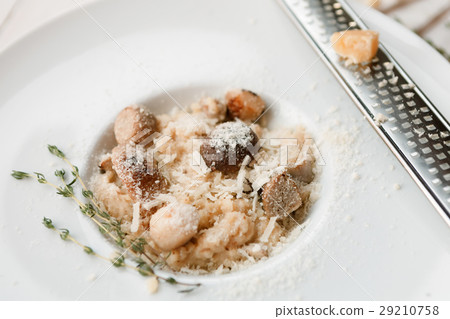 Wild mushrooms risotto with rosemary and parmesan Wild mushrooms risotto with rosemary and parmesan 29210758