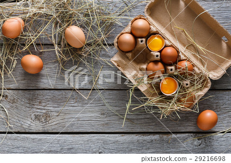 Fresh brown eggs in carton on rustic wood Fresh brown eggs in carton on rustic wood 29216698