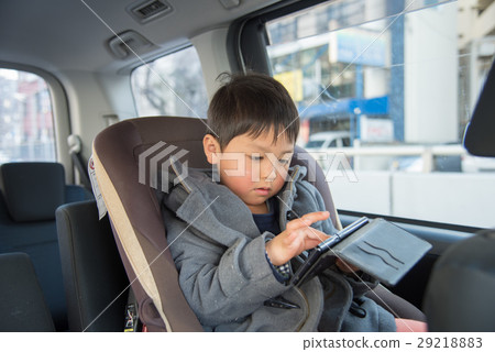 A boy who smarts in a car 29218883