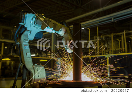 Robot is welding automotive part in factory Robot is welding automotive part in factory 29220927