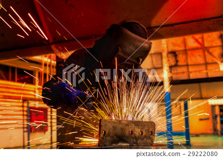 Worker welding automotive part in factory Worker welding automotive part in factory 29222080