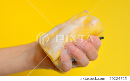 Hand with sponge with foam 29224725
