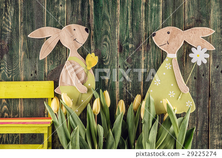 happy easter time, yellow tulips and bunnies  29225274