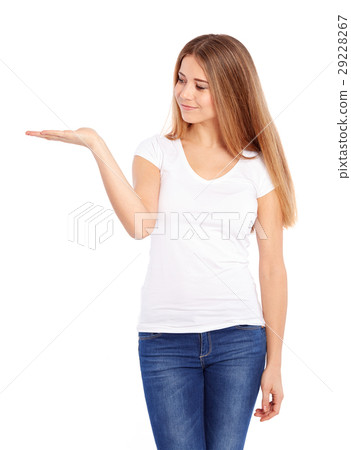 Young woman in tshirt showing empty copyspace Young woman in tshirt showing empty copyspace 29228267