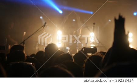 Fans waving their hands at rock concert in night Fans waving their hands at rock concert in night 29228434
