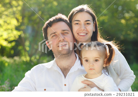 Happy young family with baby girl Happy young family with baby girl 29231021