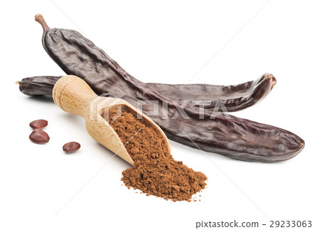 Carob powder and pods isolated on white 29233063