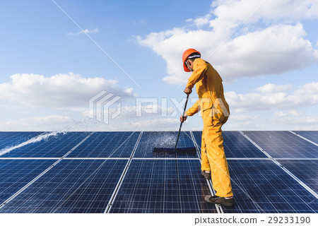 Worker cleaning solar panels Worker cleaning solar panels 29233190
