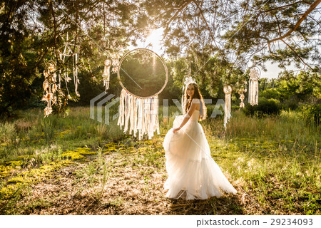 young redheaded girl smiling and hold dreamcatcher 29234093