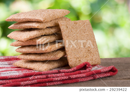 stack of crisp bread on a wooden table with 29239422