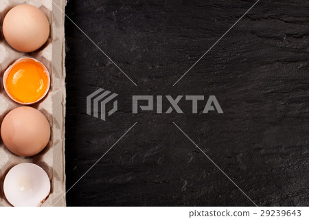 eggs in a tray on a dark background with copy 29239643