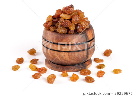 raisins in a wooden bowl isolated on white raisins in a wooden bowl isolated on white 29239675