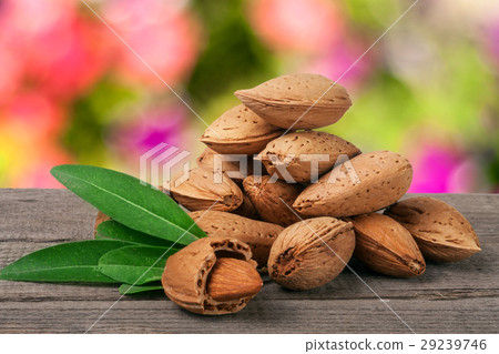 heap of almonds in their skins and peeled with heap of almonds in their skins and peeled with 29239746