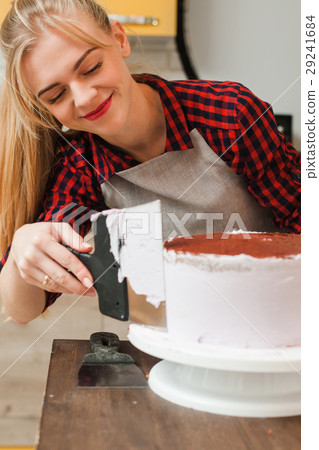 Girl making sweet dessert on kitchen. Masterclass. Girl making sweet dessert on kitchen. Masterclass. 29241684
