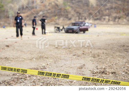police line tape with blurred law enforcement  29242056