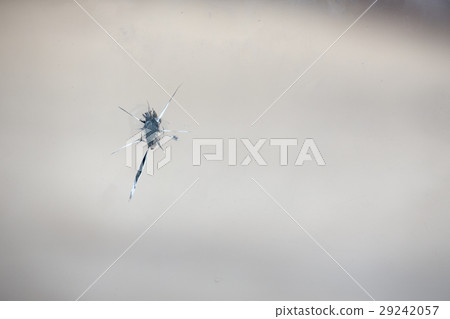 crack glass window from gun shot symbolized crime  29242057