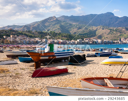 urban beach with boat in Giardini Naxos in evening 29243685
