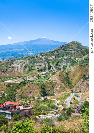 green hills with villages and Etna in Sicily 29243697
