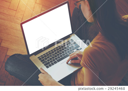 Girl using laptop and typing Girl using laptop and typing 29245468