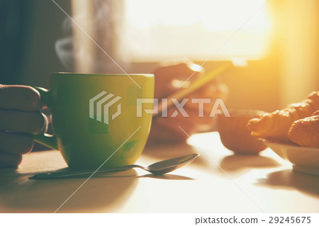 breakfast with coffee and browsing smartphone 29245675